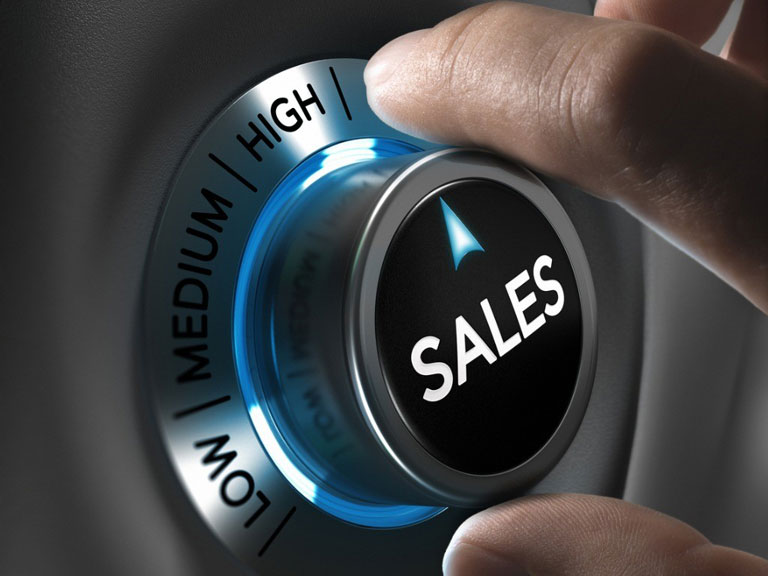 hands turning a switch reading sales to high